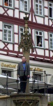 Ray Zeisset posing on pillory